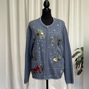 Blue zippered cardigan sweater with birds and snowflakes pattern. Size large.
